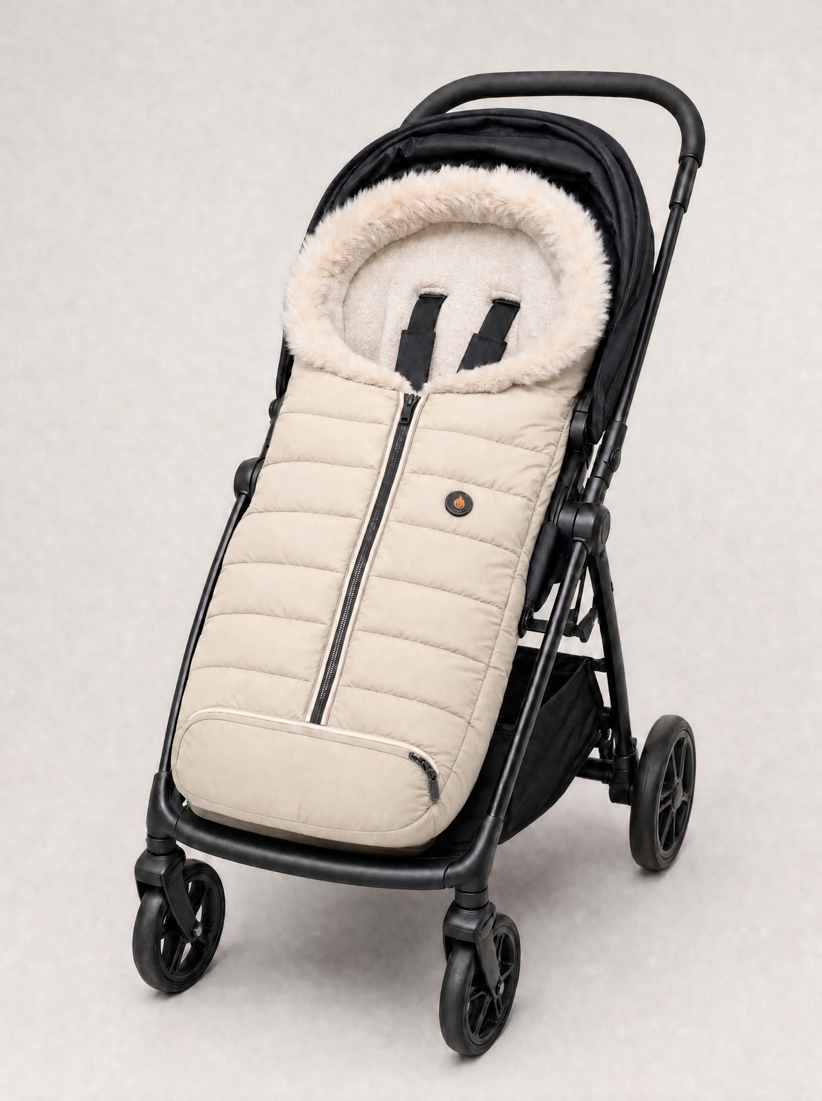 Emberbug heated footmuff in Cream fitted on a stroller